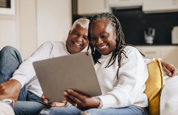 Happy_Couple_At_Home_Tablet