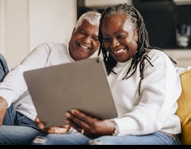 Happy_Couple_At_Home_Tablet_Smaller_Img