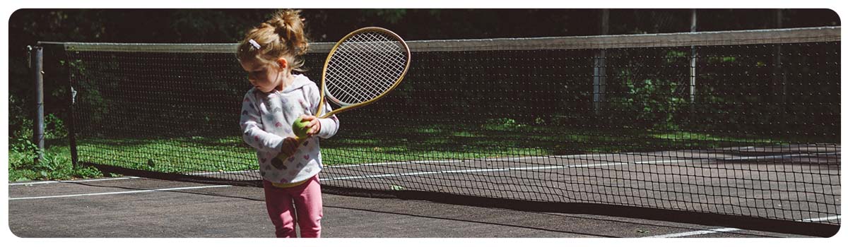 Young girl playing tennis