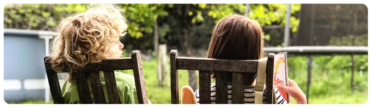 Children on a bench looking forward