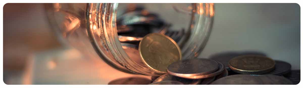 Coins spilling from a jar