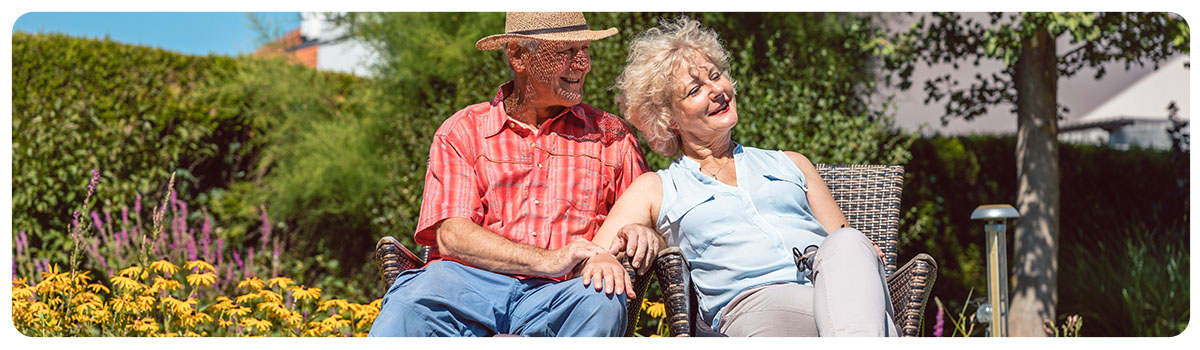 Couple lounging in garden