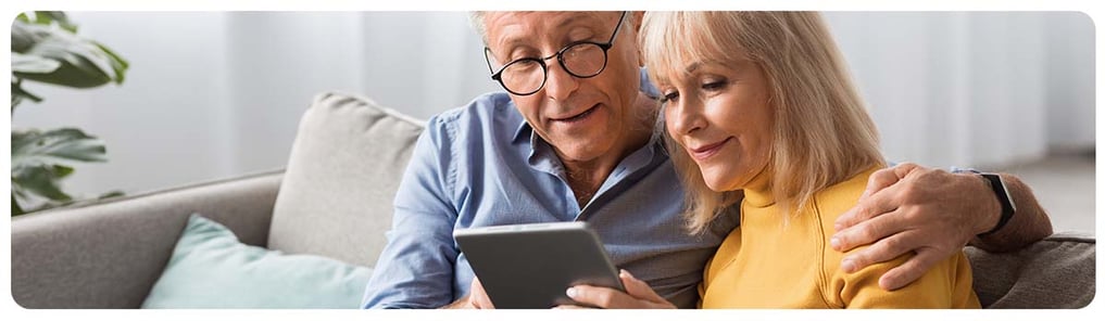 Couple searching for something on their tablet